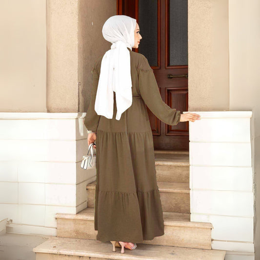 Bruine maxi jurk dames – achterkant, lange mouwen en vloeiende pasvorm